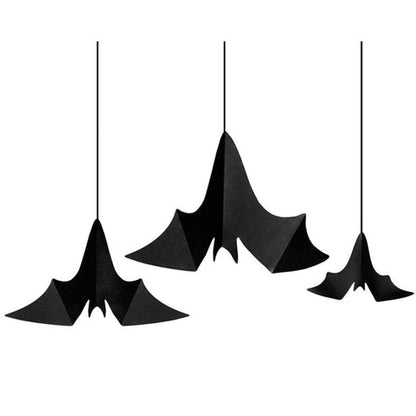 Three black paper hanging bats in varying sizes displayed against a neutral background showcasing 3D unfolded wings and dimensional craft folds.