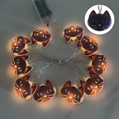 An 118-inch Harliver black cat string light strand with 20 warm LED bulbs glowing softly against a festive wall background.