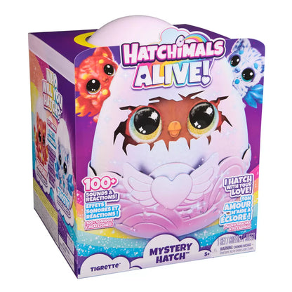 Front view of the large Hatchimals Alive Mystery Hatch egg glowing with rainbow LED lights and releasing mist from the base on a white table.