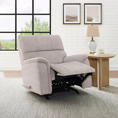 Front three-quarter angle of the True Innovations Hayden beige fabric manual recliner chair, showcasing its plush bustle-back cushion design, padded arms, and soft polyester fabric in a cozy living room.