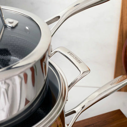 Henckels Paradigm 11-piece stainless steel cookware set with pots, pans, and lids for even heat distribution and everyday cooking