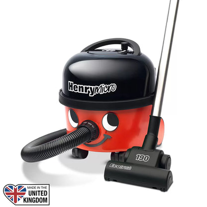 Red and black Henry Micro corded vacuum cleaner HVR.200M-11 with face logo, stainless steel wand, and attached EcoBrush tool set up on a hard floor surface.