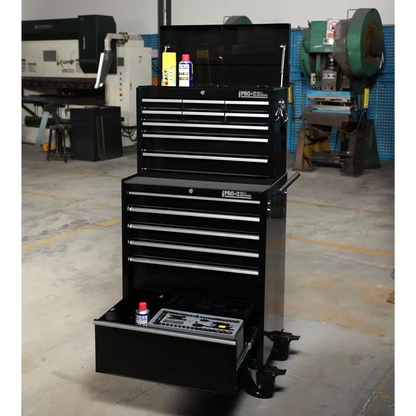 Front-angle view of the black steel Hilka HD Pro plus fifteen drawer tool chest and rolling trolley unit featuring aluminum drawer pulls in an organized automotive workshop.