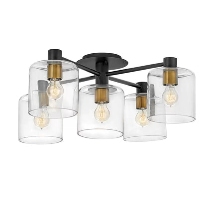 Hinkley Quintiesse Axel five-light semi-flush ceiling chandelier in matte black steel and heritage brass accents featuring clear glass globes mounted on a low ceiling.