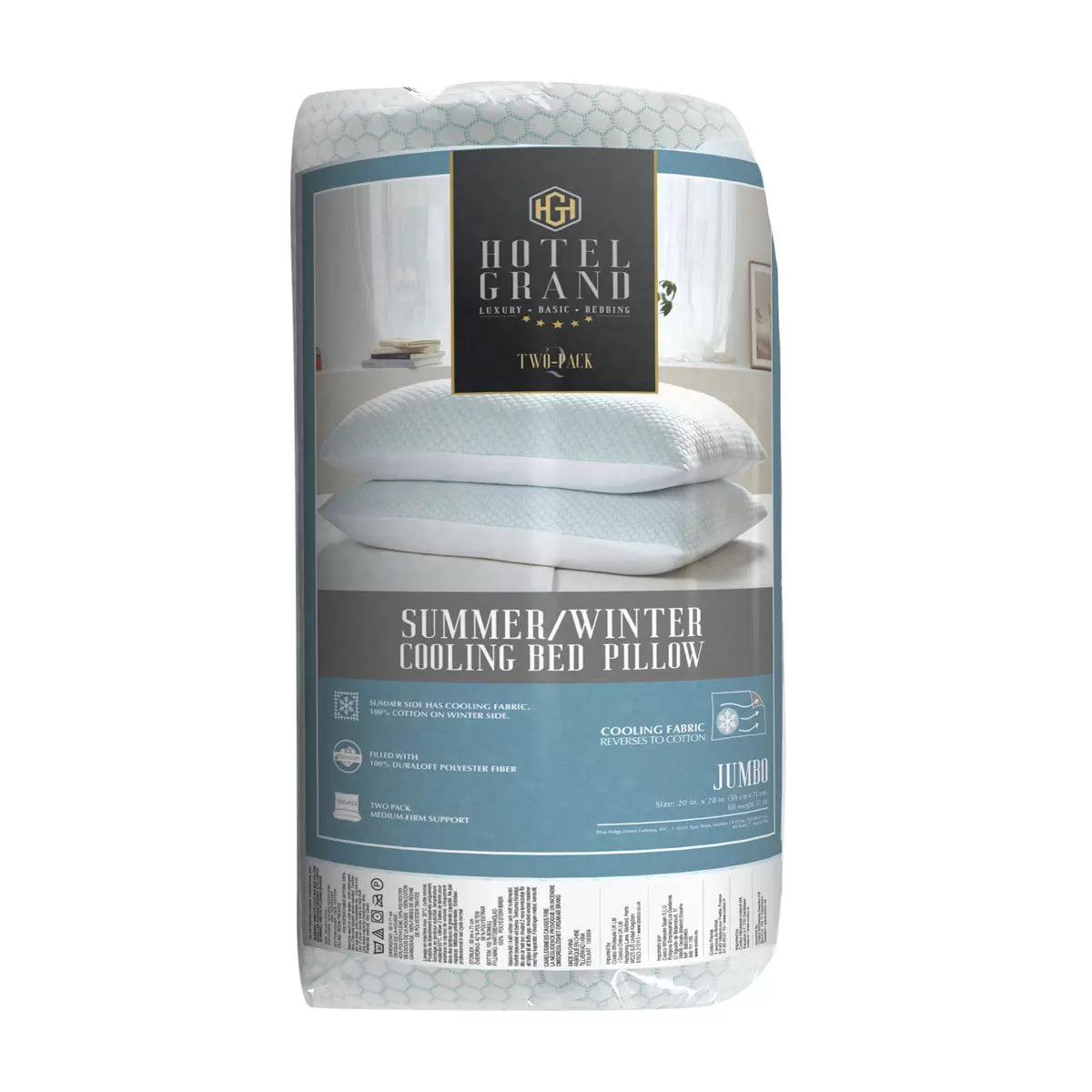 Pair of Hotel Grand reversible pillows resting on a bed displaying the blue-tinted cooling fabric side and white cotton finish.