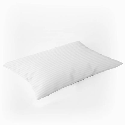 A close-up shot of two white sateen satin stripe Hotel Suite 540 thread count bolster pillowcases neatly arranged on a freshly made king-size bed.