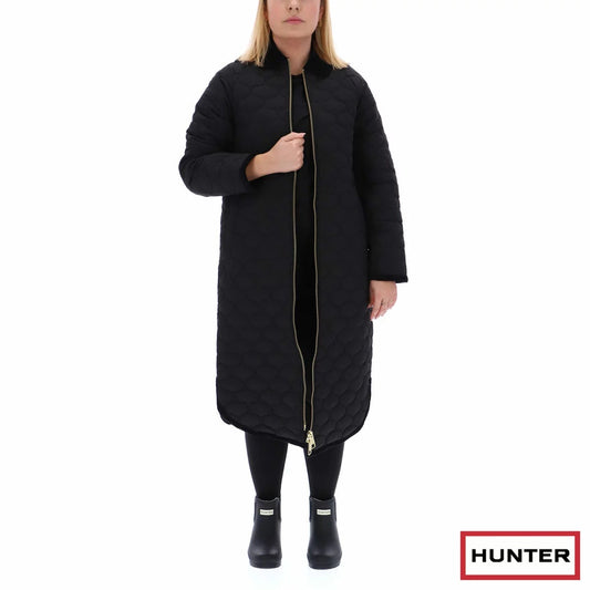 Hunter women's long onion-quilted coat with a corduroy rounded collar and double front zip displayed on a model outdoors.