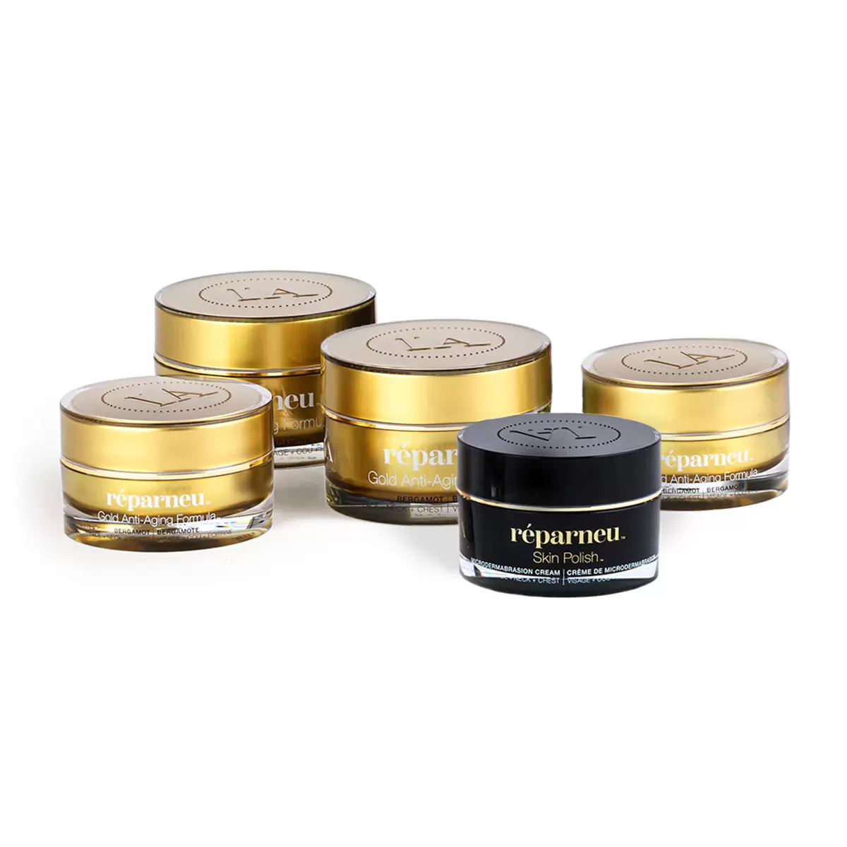 Five containers of InfiniteAloe Gold anti-aging cream and skin polish arranged on a clean white surface with natural light highlighting the premium packaging.