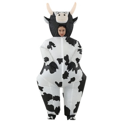 Front view of a fully inflated black and white spot adult cow costume with a cartoon face on a plain background