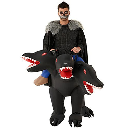 Full-length front view of an adult wearing an inflated brown three-headed Cerberus dog ride-on costume indoors with realistic black leg accents.