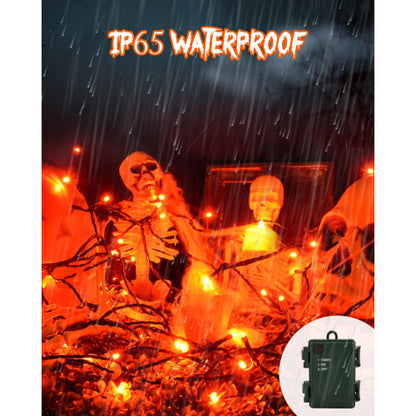 A 3-meter strand of 30 orange LED fairy lights glowing warmly on a green wire wrapped around an outdoor garden tree branch.