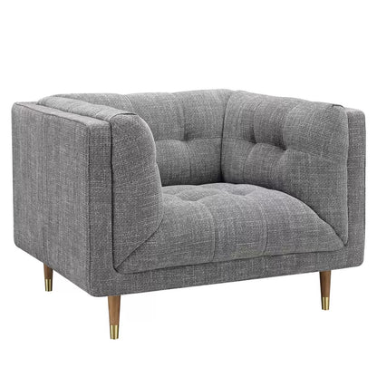 Grey fabric armchair with cushioned seat and modern design for living room and lounge interiors