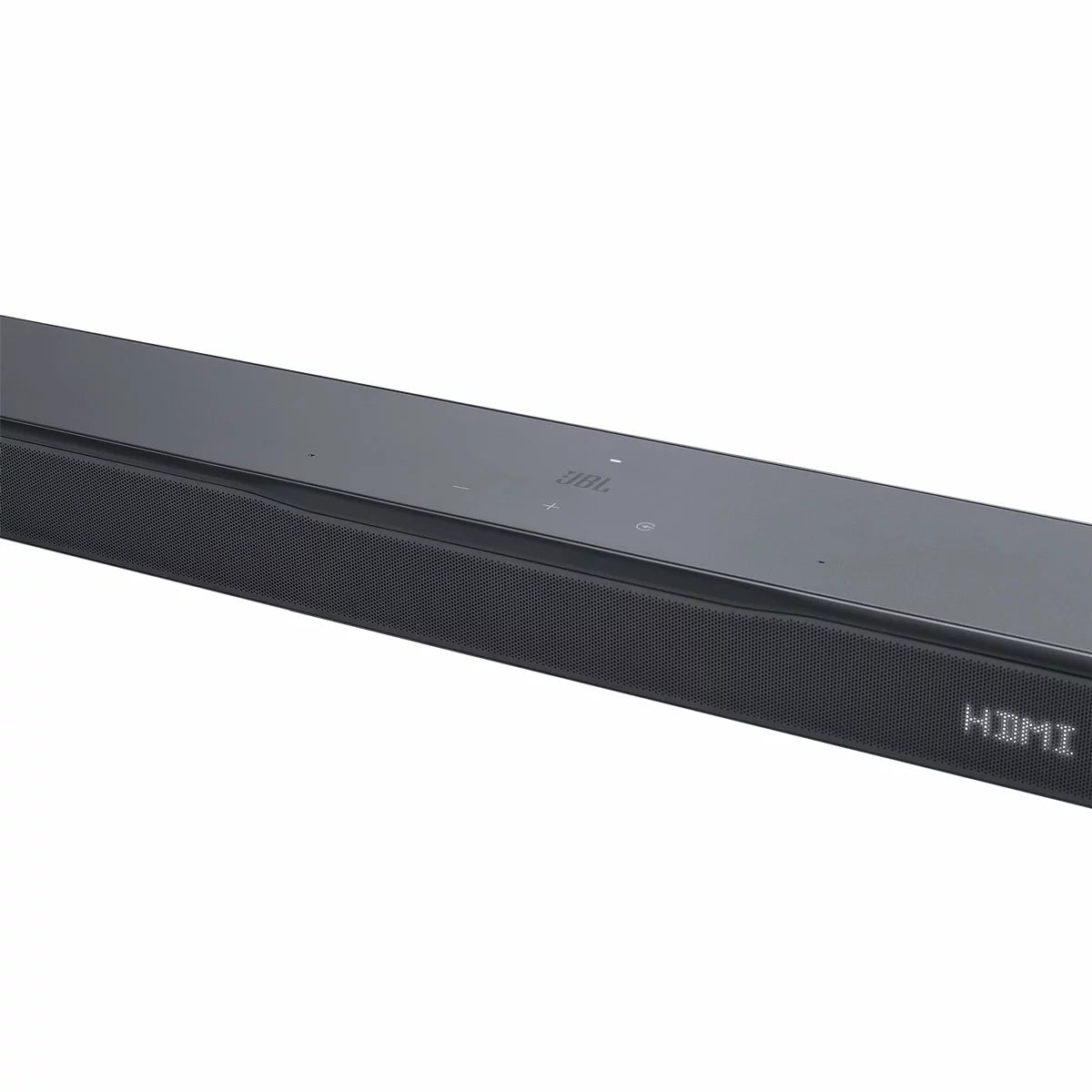 JBL BAR 500MK2 black 5.1 channel soundbar mounted under a wall-mounted TV with its 10-inch wireless subwoofer positioned on a hard-wood floor.
