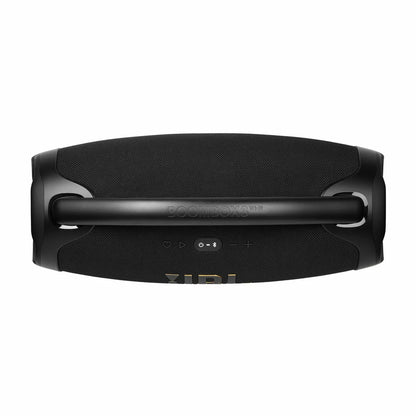 JBL Boombox 3 black Wi-Fi Bluetooth speaker featuring a sturdy metal carrying handle resting on an outdoor table next to a smartphone.