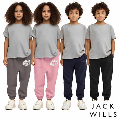 Front view of the Jack Wills Youth Jogger in navy blue, showcasing the tapered leg cut, elasticated cuffs, and jacquard brand logo detail.
