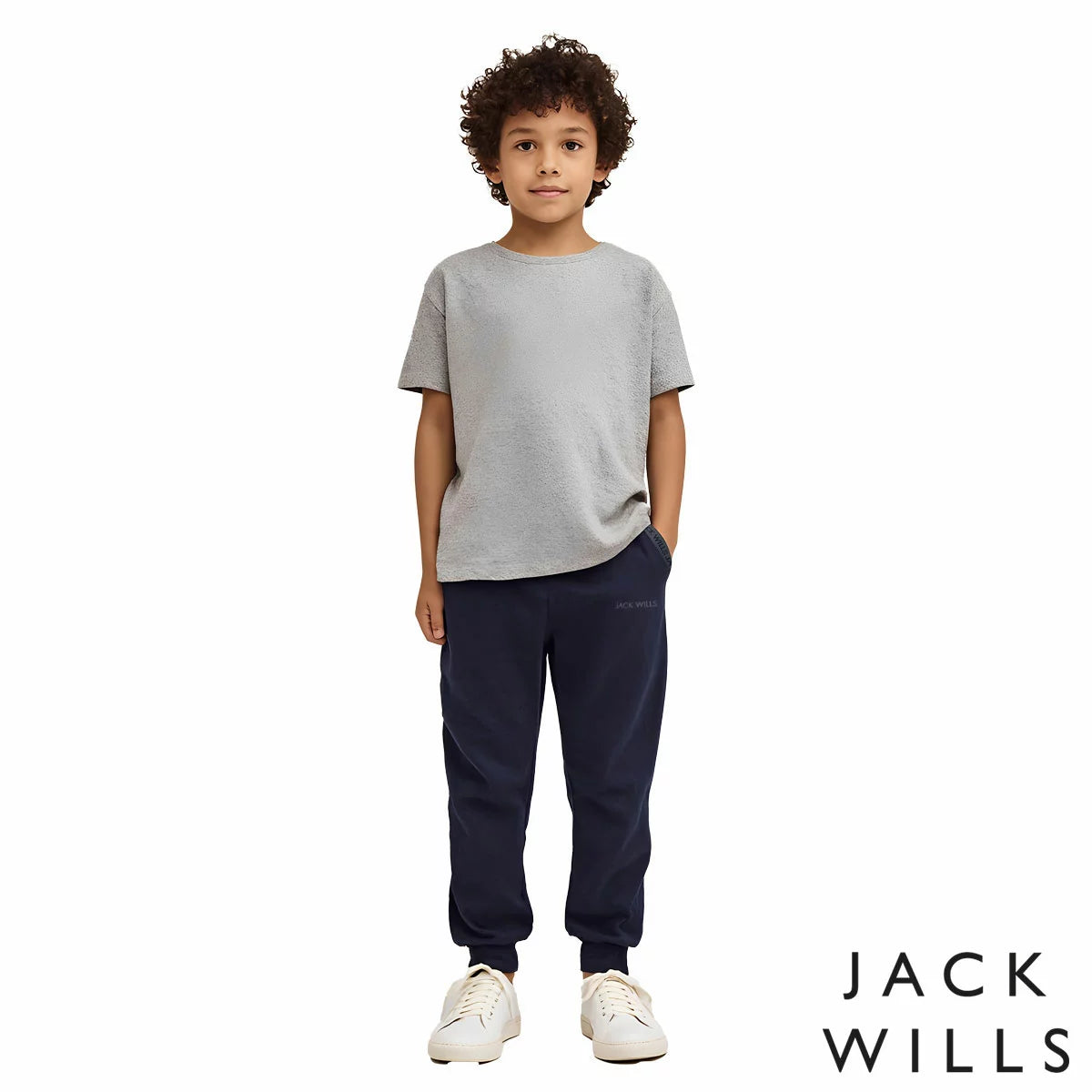 Front view of the Jack Wills Youth Jogger in navy blue, showcasing the tapered leg cut, elasticated cuffs, and jacquard brand logo detail.