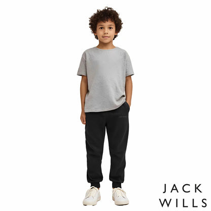 Front view of the Jack Wills Youth Jogger in navy blue, showcasing the tapered leg cut, elasticated cuffs, and jacquard brand logo detail.