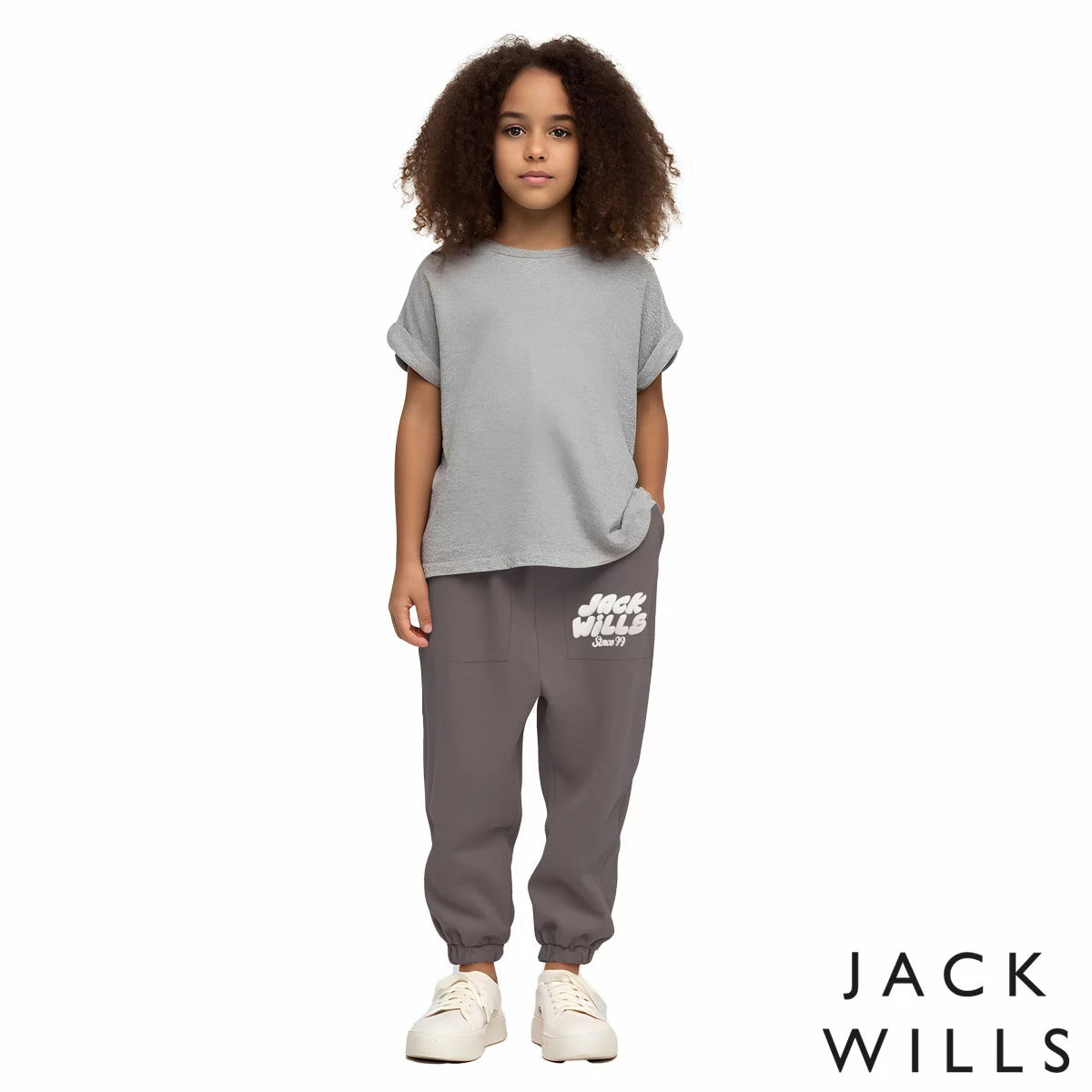 Front view of the Jack Wills Youth Jogger in navy blue, showcasing the tapered leg cut, elasticated cuffs, and jacquard brand logo detail.