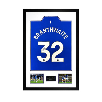 An official Everton 24/25 football shirt signed by Jarrad Branthwaite, displayed in a professional frame with two action photos and authentication documentation.
