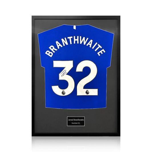 A professionally framed Everton football shirt signed by Jarrad Branthwaite, displayed with a choice of black or white mounting against a neutral gallery background.