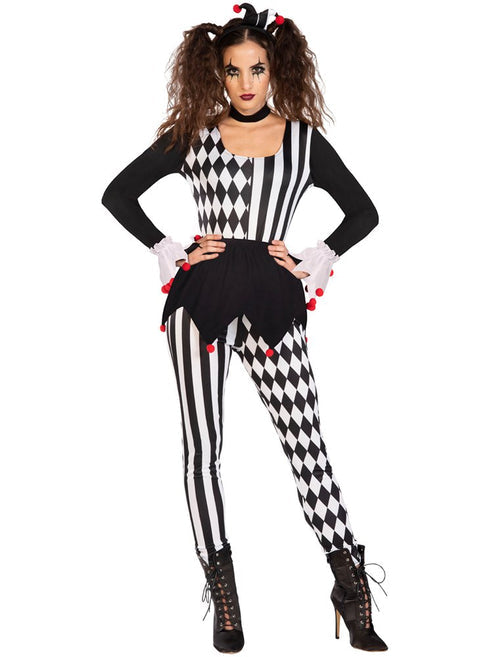 Adult wearing a vibrant red and black jester costume with a pointed hat posing against a dark background.