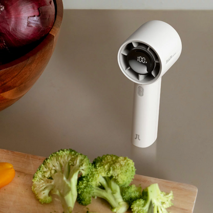 Compact dark grey JisuLife Life10 S handheld fan standing upright showing its digital LED battery display and 9-blade fan head.