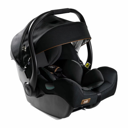 Rear angle view of the Joie I-Jemini infant carrier showing the Tri-Protect headrest layers and side impact protection shell.