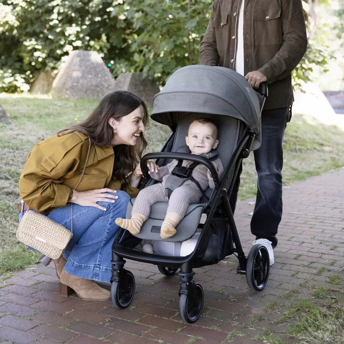 Joie Signature Parcel LX stroller in Maple colorway folded down into its ultra compact travel carry bag
