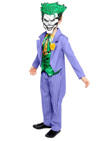 Front view of a child wearing the purple Joker comic costume with attached green vest and trousers against a neutral studio backdrop.