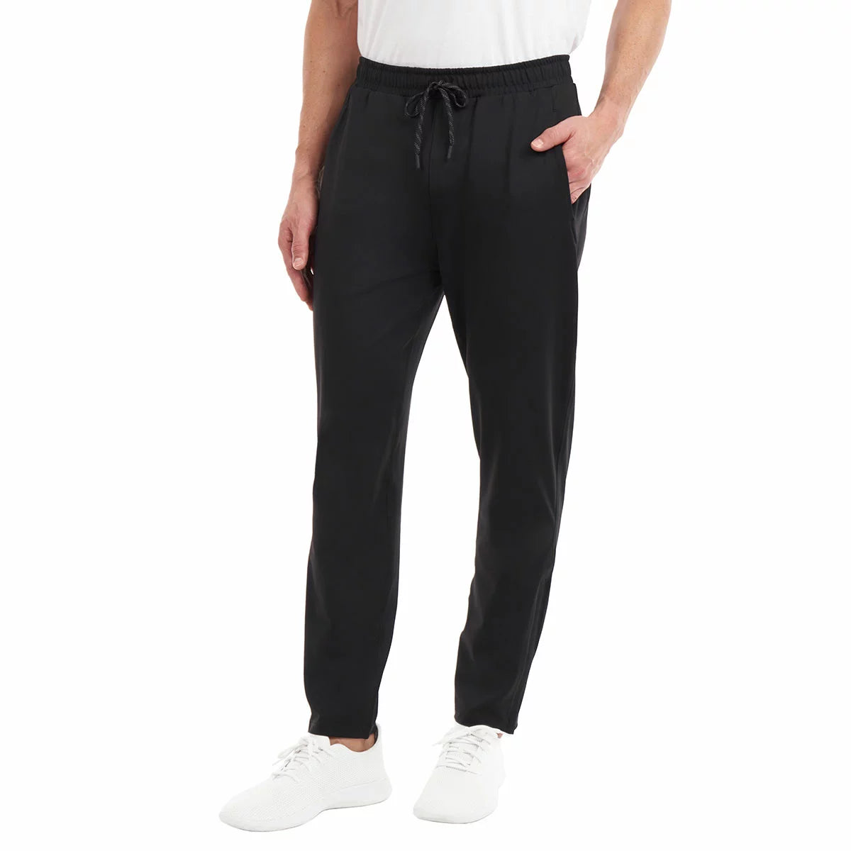 KS Men's Active Pant with stretch performance fabric andFront view of a man wearing black KS Men's Active Pants with tapered zipped cuffs and an adjustable drawstring waistband. breathable athletic casual design/2