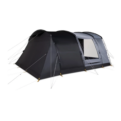 A green and grey Kampa Dawlish 4 Person Tunnel Tent pitched on a lush green grass campsite with its large side door open revealing the darkened inner sleeping compartment.