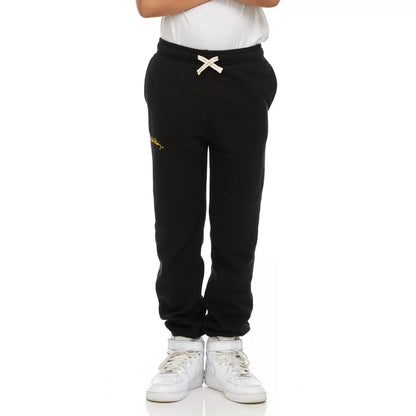 Front view of Keith Haring youth fleece joggers in green showing iconic pop art graphics, side pockets, and an elastic drawstring waistband.