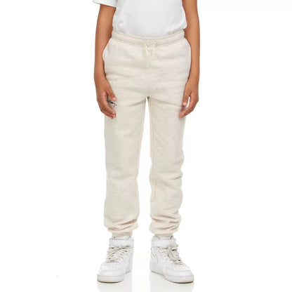 Front view of Keith Haring youth fleece joggers in green showing iconic pop art graphics, side pockets, and an elastic drawstring waistband.
