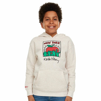 Close-up of the beige Keith Haring youth fleece hoodie showcasing the graphic front artwork, lined hood, and front kangaroo pocket on a neutral background.