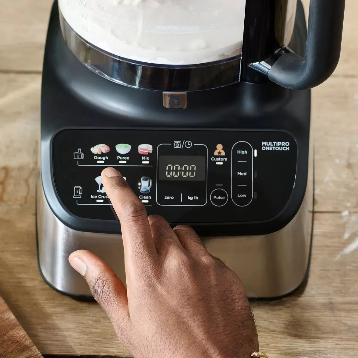 The Kenwood MultiPro OneTouch FDM73.480SS processor and blender in a modern kitchen, featuring the digital scale interface and various included attachments.