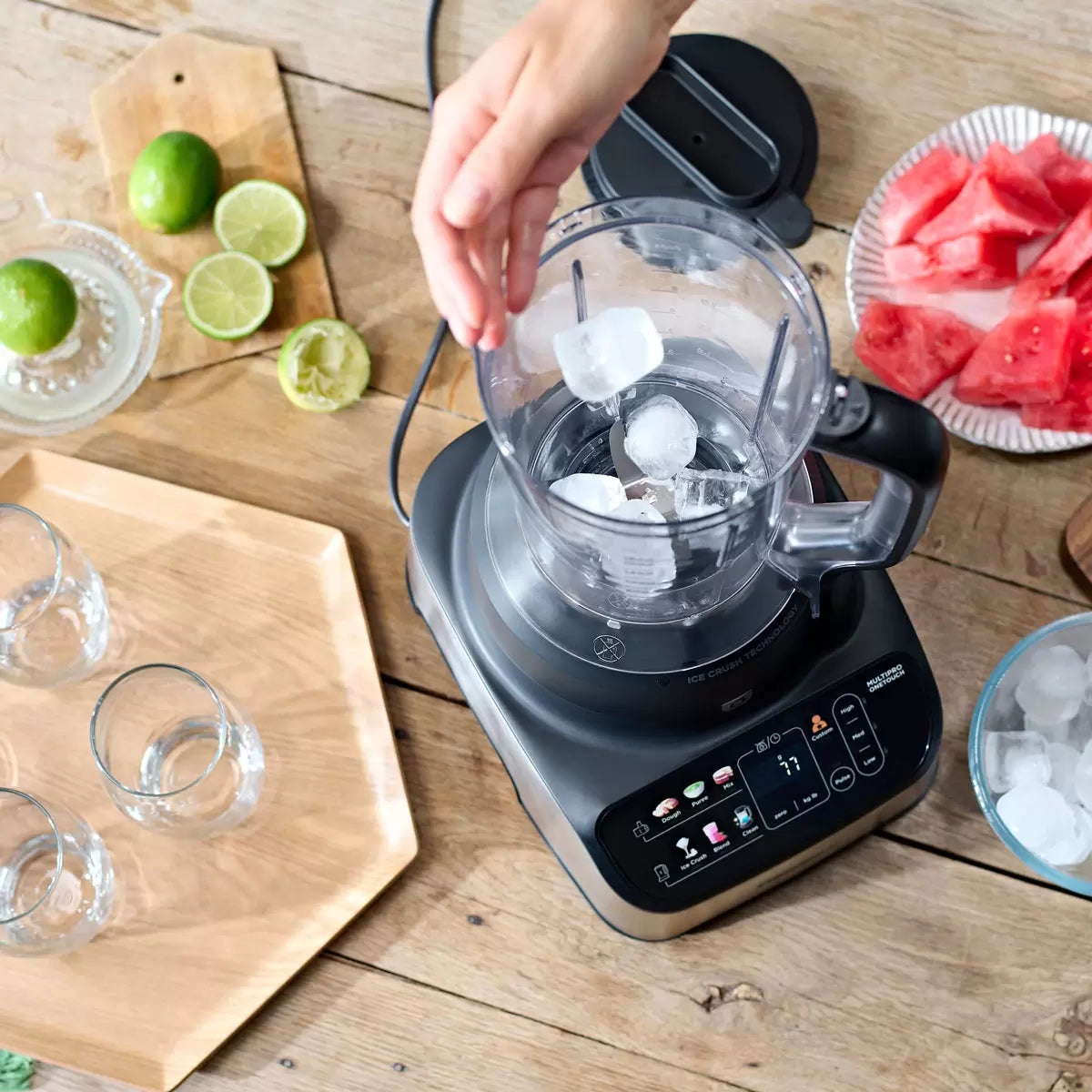 The Kenwood MultiPro OneTouch FDM73.480SS processor and blender in a modern kitchen, featuring the digital scale interface and various included attachments.