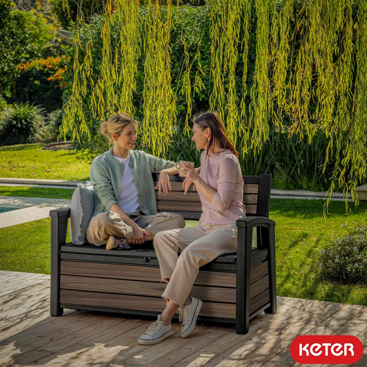 Keter Rosewood 227 Litre brown wood-effect garden storage bench for two people.