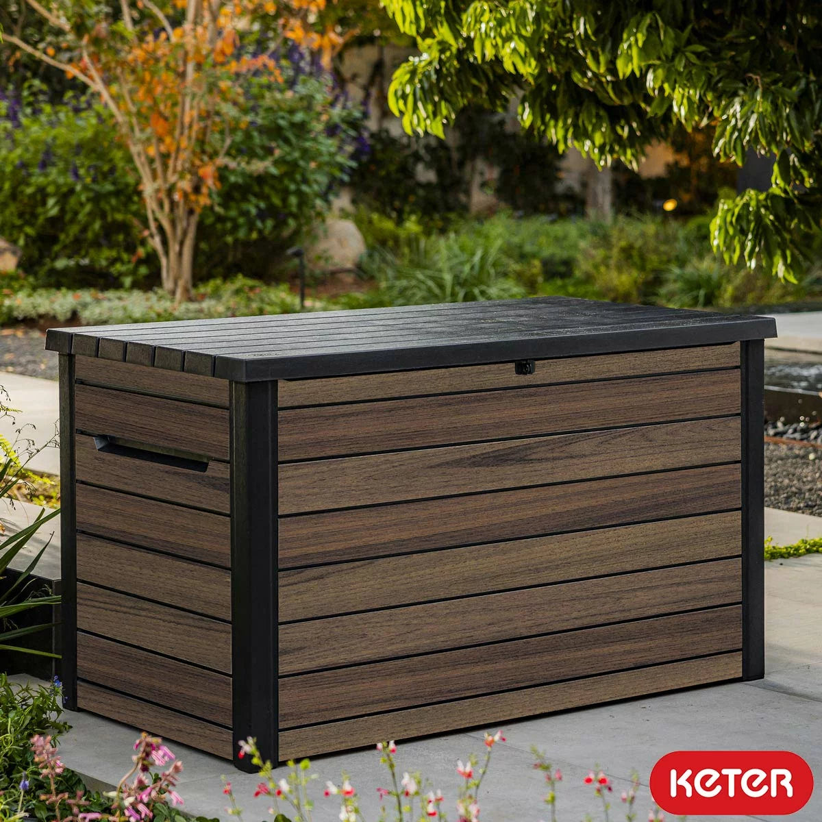 Keter Rosewood 870 Litre dark brown wood-effect deck box with open lid and divider.