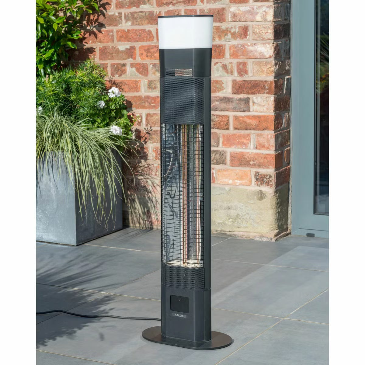 Kettler Kalos Ibiza floor standing garden heater in dark grey finish with illuminated LED ring and built-in speaker standing on a wooden patio deck.