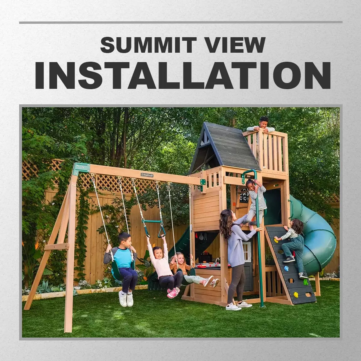 Professional technician in workwear assembling a large wooden outdoor playcentre on a level garden lawn.