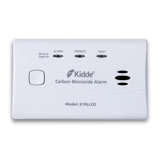 Front angle view of the compact white Kidde Carbon Monoxide Alarm displaying test button and LED status indicators on a tabletop setting.