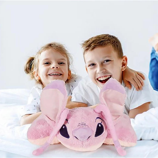 Licensed character children's pillow play pal made of soft faux rabbit fur shown in folded plush toy and opened cushion positions on a bed.