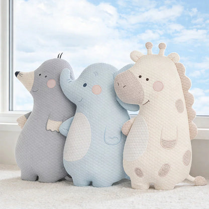 Zoobies Kids Cooling Animal Pillow in cute giraffe shape displayed on a bed showing textured cooling cover and plush filling.