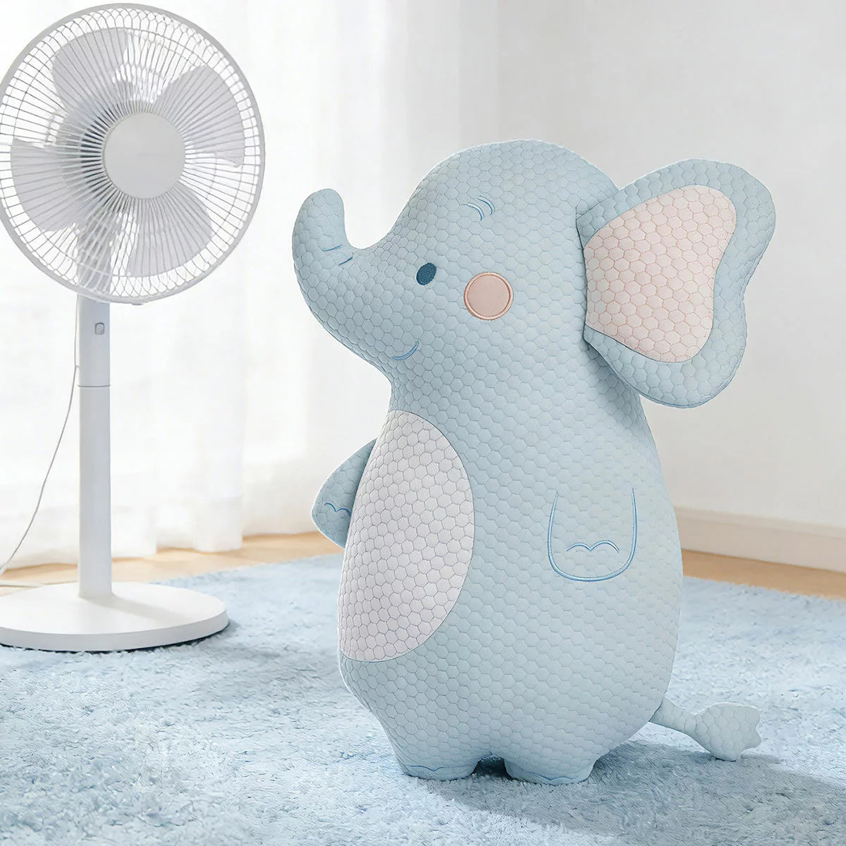 Zoobies Kids Cooling Animal Pillow in cute giraffe shape displayed on a bed showing textured cooling cover and plush filling.