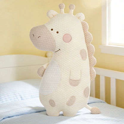 Zoobies Kids Cooling Animal Pillow in cute giraffe shape displayed on a bed showing textured cooling cover and plush filling.