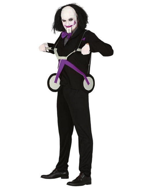 Front view of adult wearing a creepy killer tricycle illusion costume with red suit jacket and white face paint in a party setting.