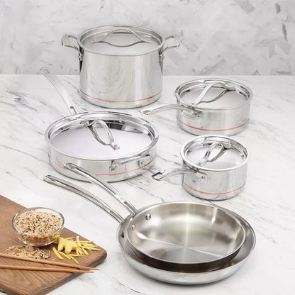 Kirkland Signature 10-piece stainless steel cookware set with copper core layers displayed on a modern kitchen countertop showing saucepans, stockpot, and skillets.