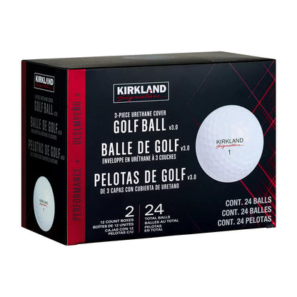 High-angle studio shot of two dozen white Kirkland Signature 3-piece urethane golf balls arranged neatly inside their distinct red and black packaging on a dark reflective surface.