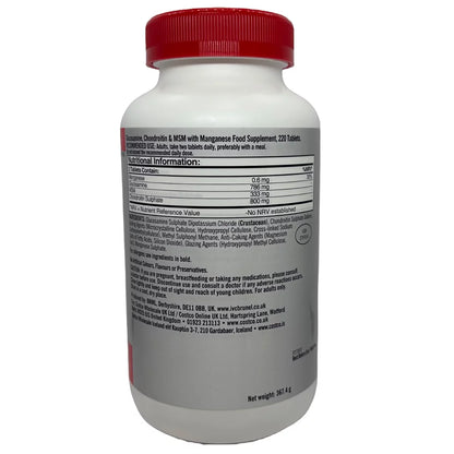 Front view of the Kirkland Signature Glucosamine Chondroitin and MSM 220-tablet bottle resting upright on a clear surface in bright light.