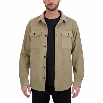 Front view of the black Kirkland Signature heavyweight shirt jacket featuring chest button pockets and button cuffs displayed on a neutral background.
